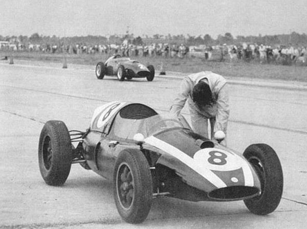Jack Brabham pushing his Cooper F1 car the last 400 yards of the American Grand Prix in 1959